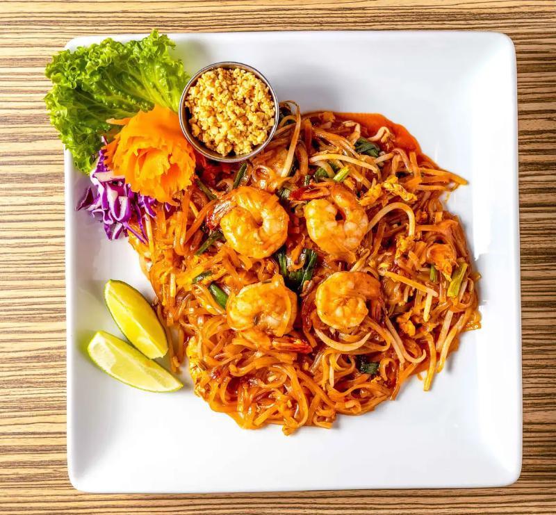 P1. Pad Thai · Stir fried thin rice noodles with your choice of protein, eggs, bean sprouts and scallions in a pad thai sauce topped with ground peanuts.