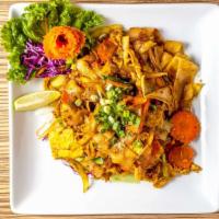 P2. Twisted Yellow Curry Noodles · Stir-fried flat noodles with eggs, onions, carrots and scallions in yellow curry powder, ser...