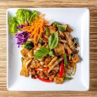 P7. Crispy Drunken Noodles · Stir-fried crispy flat noodles with eggs, baby corn, basil leaves, bell peppers and onions i...