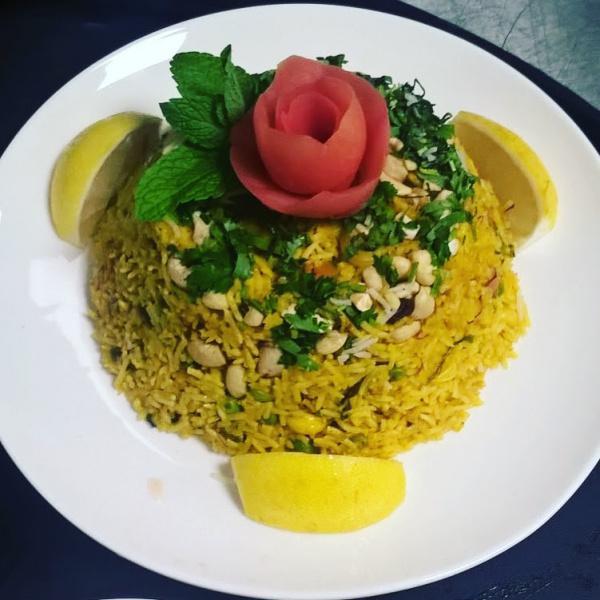 Meat Biryani Rice · Aged steamed white basmati rice, cardamom, nuts, herbs and freshly ground spices. Served with raita.