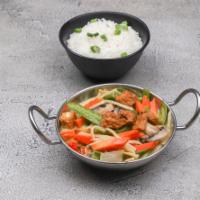 Green Curry Dinner · Green curry coconut sauce with bamboo shoots, green beans, red bell peppers and fresh Thai b...