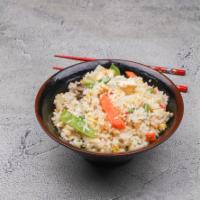 Fried Jasmine Rice Dinner · Stir-fried with an egg, green peas, diced carrots and fresh scallions in light soy sauce.