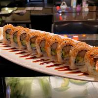 Shrimp Tempura Roll · Shrimp tempura, cucumber, avocado, masago and eel sauce. Rice outside.