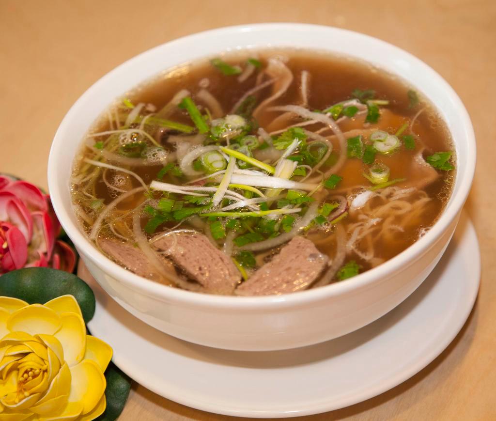 P1. Pho Sen Special Beef Soup · Eye round steak, well-done brisket, flank, tripe, soft tendon, and beef meatball with noodle soup.