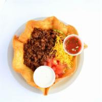 Taco Salad · Your choice of chicken or seasoned ground beef, refried beans, lettuce, tomatoes, cheese, an...