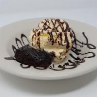 Chocolate Volcano · Chocolate brownie volcano with a scoop of vanilla ice cream, and drizzled with chocolate sau...