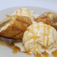 Fried Cheesecake · Fried cheesecake with caramel and vanilla ice cream.