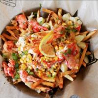 Lobster Poutine  · Succulent Canadian lobster claw and knuckle meat enveloped in a creamy citrus garlic sauce w...