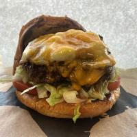 Cadillac Burger · 6 oz. hand formed patty topped with caramelized onions and a melted blend of cheese curds an...
