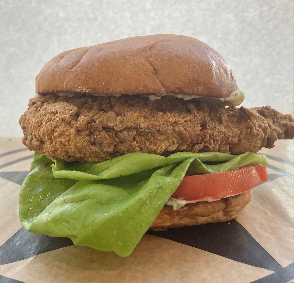 Tubs Chicken Sandwich · Buttermilk brined chicken tenders are fried in our signature gluten free seasoned flour or grilled and placed on a toasted Slow Dough challah bun smeared with roasted garlic herb mayo, pickles, thick cut tomato and bib lettuce. Served with fries of your choice.