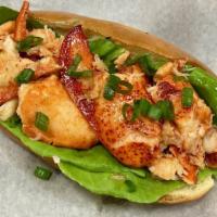 Lobster Roll · Tender butter poached Canadian lobster claw and knuckle meat is nestled into a Slow Dough ch...
