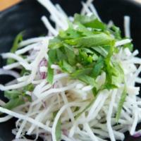 Daikon Salad · Shredded daikon radish, watercress and red onion topped with ponzu and grated radish dressing.