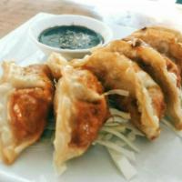 Thai Dumplings (6 pieces) · Deep fried minced chicken and vegetables stuffed in gyoza pocket served with sweet soy sauce.