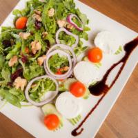 Goat Cheese Salad · Arugula, cherry tomatoes, cucumber, walnuts and cranberries tossed with balsamic dressing an...