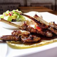 Baby Lamb Chops · Tender lamb chops marinated in our chef's special sauce and grilled to perfection. Served wi...