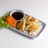 16. Pot Stickers · Ground pork cabbage, green onion, ginger, egg, salt, sesame oil served with soy sauce on the...