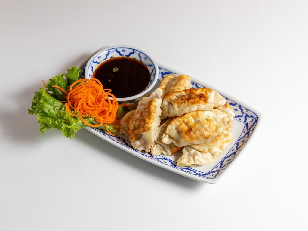 16. Pot Stickers · Ground pork cabbage, green onion, ginger, egg, salt, sesame oil served with soy sauce on the side.