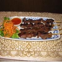 20. Thai BBQ Beef · Beef marinated with Thai herbs on a stick, grilled to perfection served with chili.