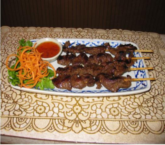 20. Thai BBQ Beef · Beef marinated with Thai herbs on a stick, grilled to perfection served with chili.