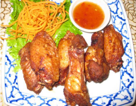 Fried Chicken Wings  · Marinated chicken wings deep-fried and served with sweet chili sauce