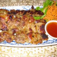 21. Thai BBQ Chicken · Chicken marinated with Thai herbs on a stick, grilled to perfection served
with chili sauce.