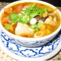 25. Tom Yum Soup · Hot and sour soup with chicken, mushroom, lemongrass, tomatoes, lime juice. Substitute shrim...