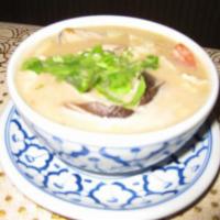 27. Tom Kha Soup · Chicken in a creamy soup flavored with coconut milk, galangal, lime juice, tomatoes, mushroo...