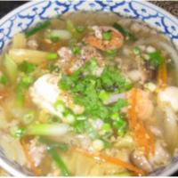 28. Crystal Noodle Soup · Bean thread noodle in a light broth with ground pork, shrimp, seafood ball, nappa, mushroom ...