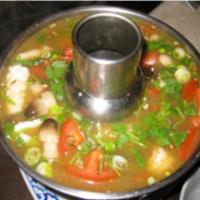 Pho Tak Seafood Soup · Hot and sour soup with combination seafood and mushroom, lemon grass,
tomatoes, lime juice.