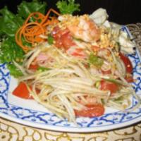 30. Thai Style Papaya Salad · Shredded raw papaya mixed with ground peanut, tomatoes, fresh chili, long bean, dried shrimp...