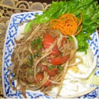 31. Laos Style Papaya Salad · Shredded raw papaya mixed with tomatoes, long bean, fresh chili, fresh lao’s makok and homem...