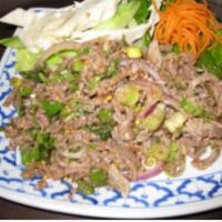 39. Larb Salad · Choice of chicken, pork, beef, or shrimp mixed with roasted rice powder, mint leaves, green ...