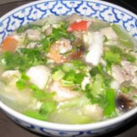 56. Sukiyaki · Bean threads noodles, egg, combination of seafood, seafood ball, beef, chicken, pork and veg...