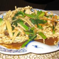 61. Crispy Noodle · Deep-fried crispy noodle topped with gravy made of Chinese broccoli, broccoli. Choice of bee...