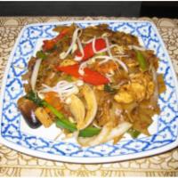 64. Drunken Noodle · Soft wide rice noodles with long bean, carrot, baby corn, onion and holy basil. Choice of be...