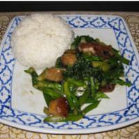 74. Roasted Pork and Chinese Broccoli Over Rice · Stir-fried Chinese broccoli with roasted pork and oyster sauce over rice.
