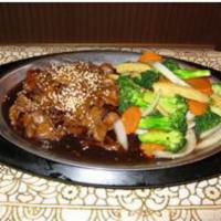 104. Bangkok Beef Pan · Sauteed sliced beef in chef’s special sauce and sauteed vegetables.