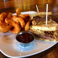 Fields Patty Melt · 6 oz seasoned beef patty topped with cheddar & pepper jack cheeses, onion, jalapeno & garlic...