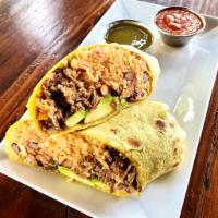 Killer Burrito · Tender chicken or pork, garlic rice with homemade salsa de arbol, avocado, jalapeno sauce, f...