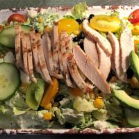 Southwest Chopped Chicken Salad · Romaine hearts, seasoned chicken, cucumber, heirloom cherry tomato, charred corn, queso fres...