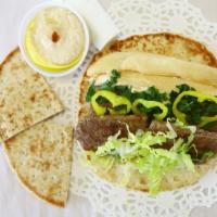 2. Chicken Kafta Sandwich Combo · With hummus, lettuce, mint, and pickles. Wrapped in pita bread. Served with side hummus, hal...