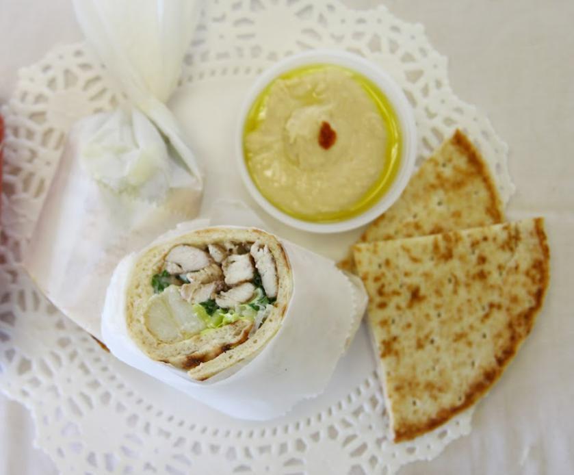 4. Chicken Shawarma Gyro Sandwich Combo · With lettuce, fries, pickles, mint and garlic mayo sauce. Wrapped in pita bread. Served with side hummus, half pita bread and a beverage.
