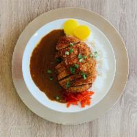 B6. Katsu Curry · Fried pork cutlet with  steamed rice , delicious curry, and Japanese style pickle