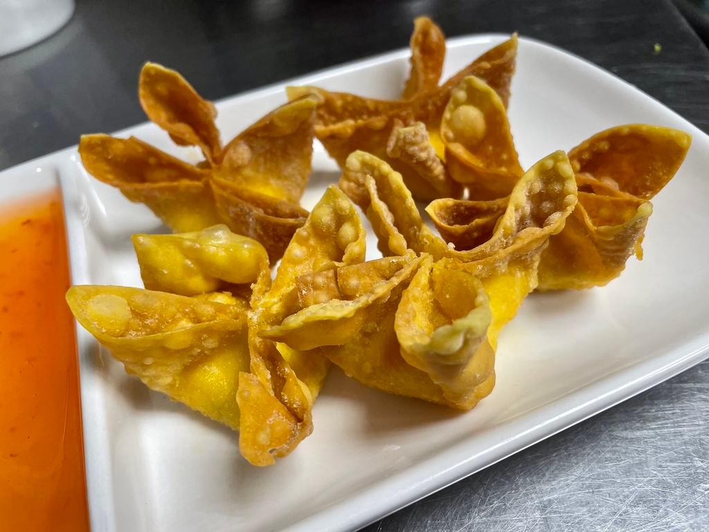 Crab Rangoon · Fried wontons stuffed with cream cheese and imitation crab meat served with sweet chili plum sauce.
