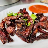 Thai Beef Jerky · Fried marinated Thai-style beef jerky served with Thai sweet chili sauce.
