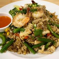Basil Fried Rice · Jasmine rice with egg, onions, bell peppers, green beans, and basil.
