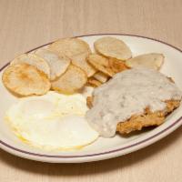 Country Fried Steak · Served with 2 eggs, spuds and toast.