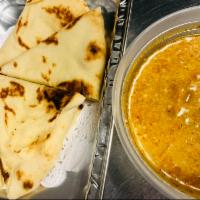 Siam Roti · Worm Indian naan bread, served with house curry dipping.