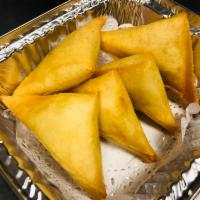 Tiny Triangle (6pcs) · Vegetable turnovers filled with potato carrot and pea with spices, served with sweet and sou...