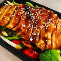 Chicken Teriyaki · Grilled chicken with teriyaki sauce on a bed of steamed mixed vegetable.